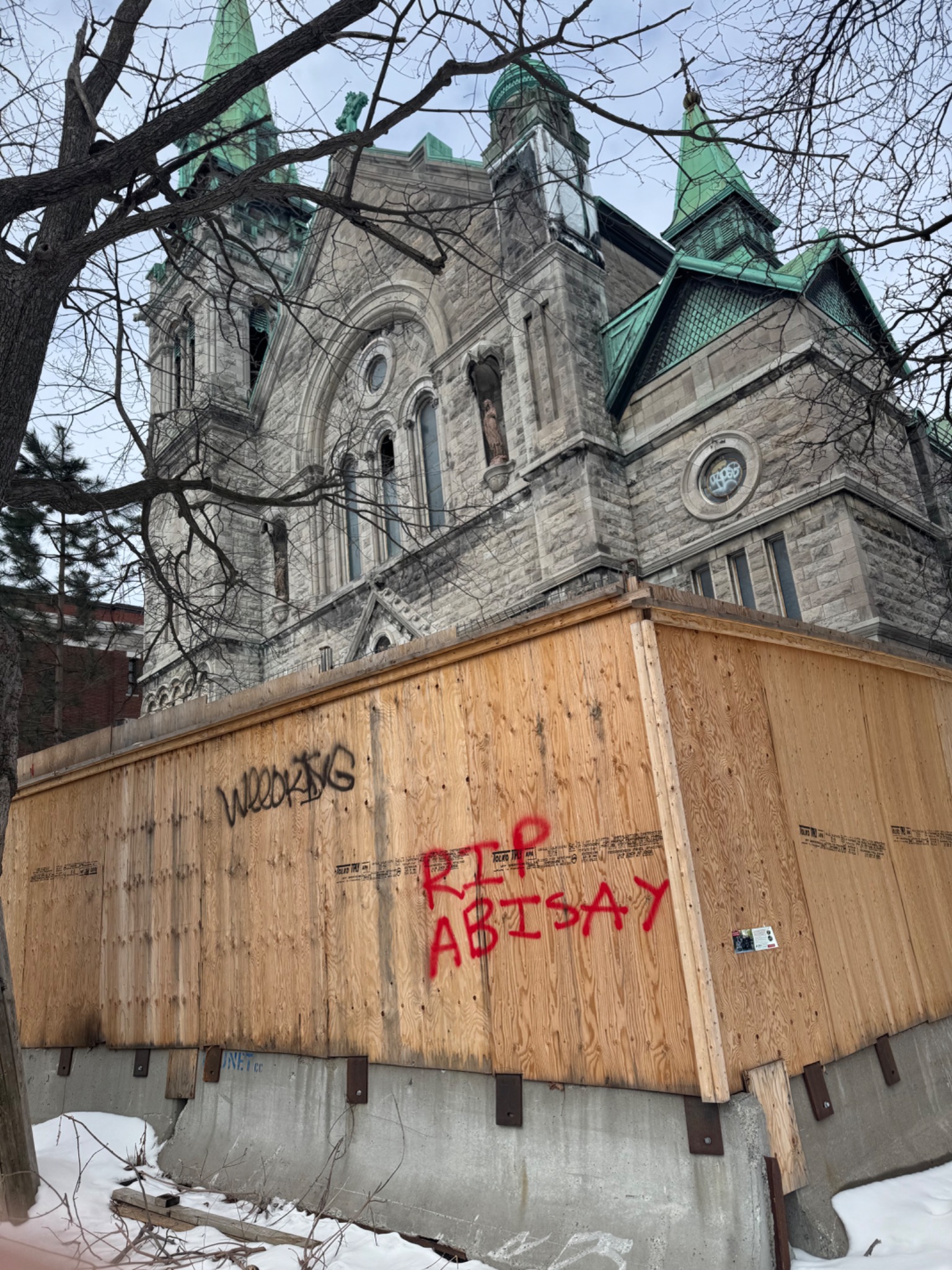 Rue Fullum church, boarded openings and graffiti, Montreal, Quebec. Photograph by Richard Wainwright.